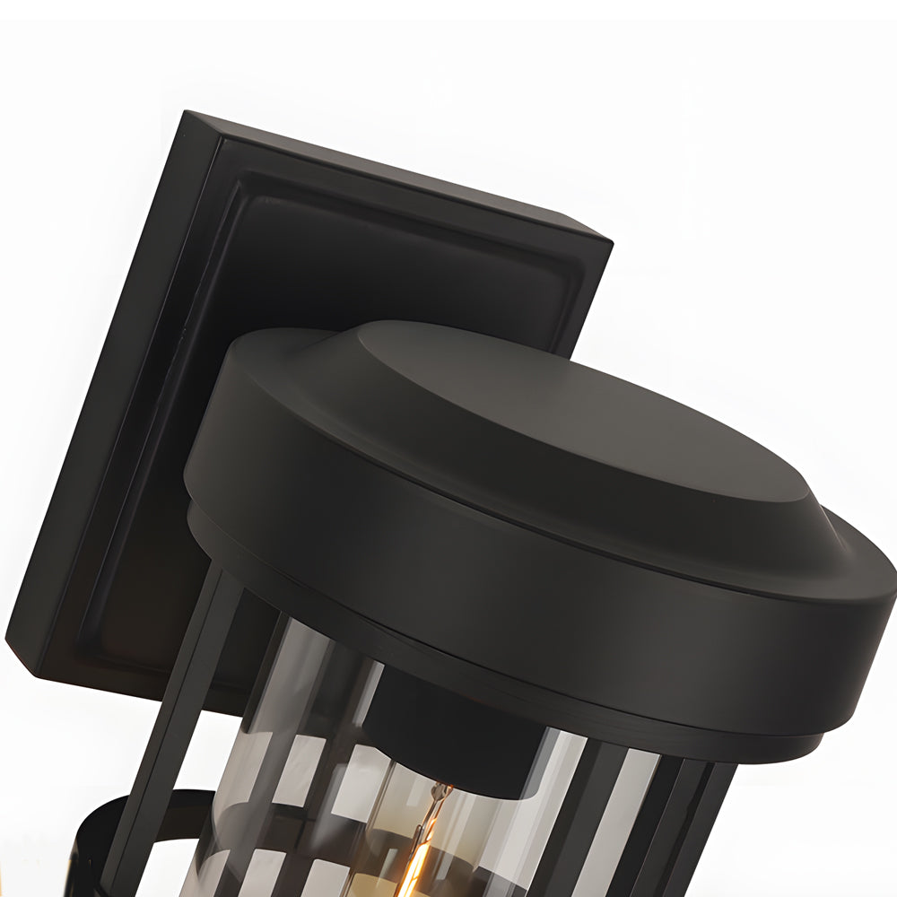 Close-up detail of wall sconce mounting mechanism showing black metal construction and hardware