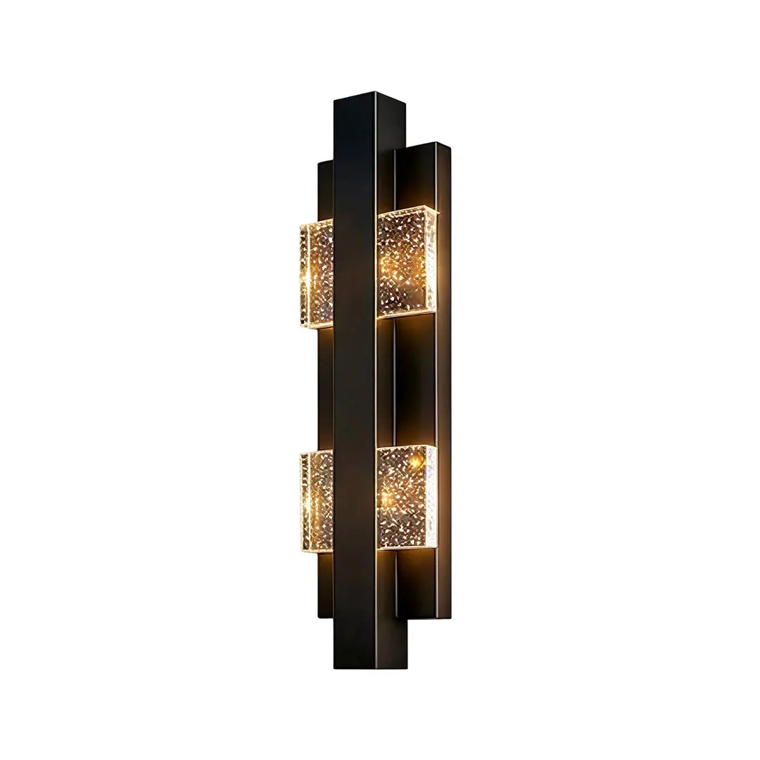 Wall sconce up and down light in a tall vertical style with three glowing crystal diffuser sections.