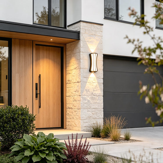 Close-up of wall up and down light showing warm dual-beam lighting effect on neutral wall.