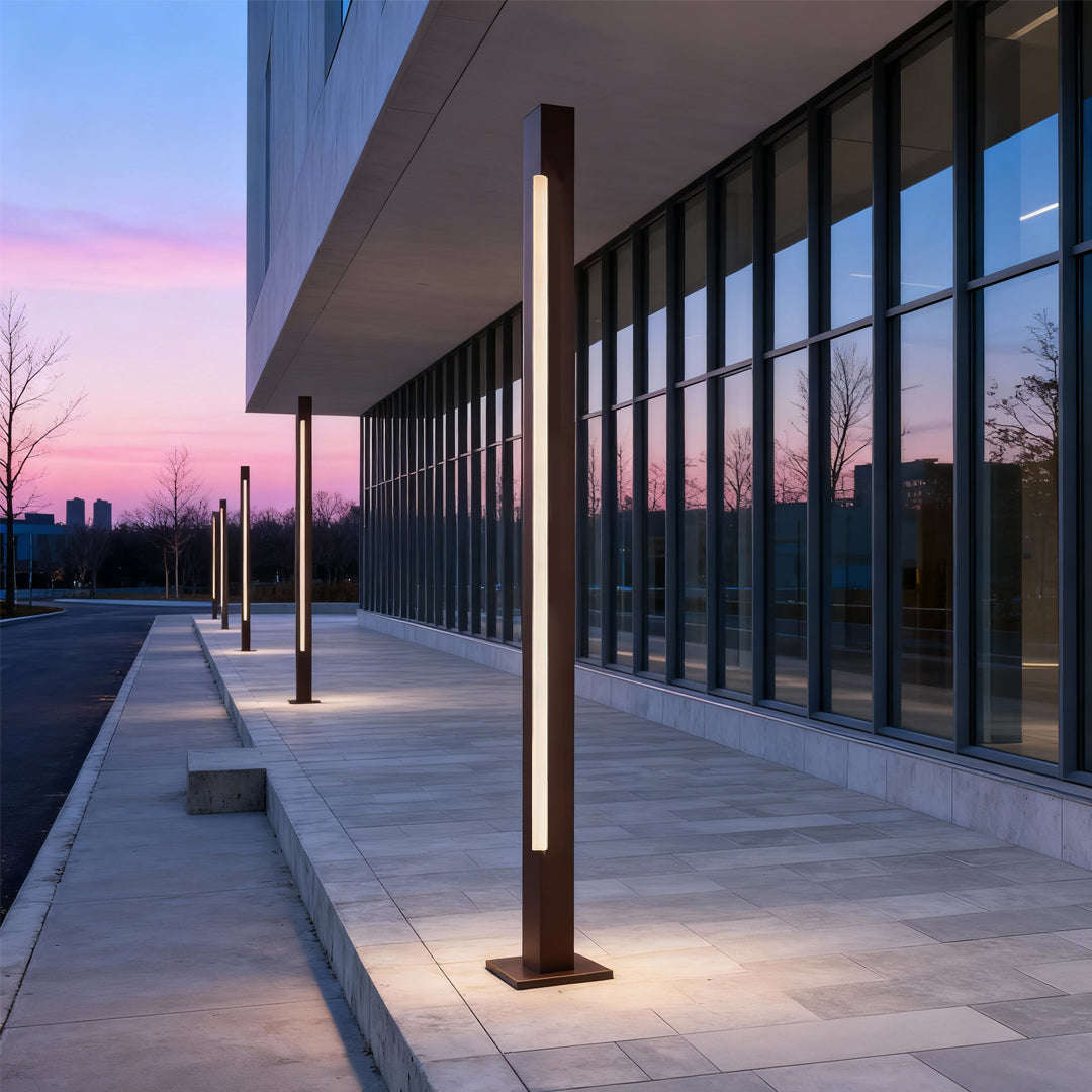 Outdoor garden pathway lit by warm-toned led bollard light fixtures creating a vibrant nighttime ambiance.