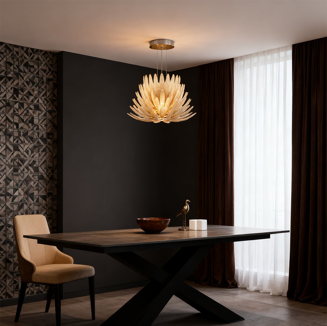 Warm glass deco chandelier illuminating cozy dining area.