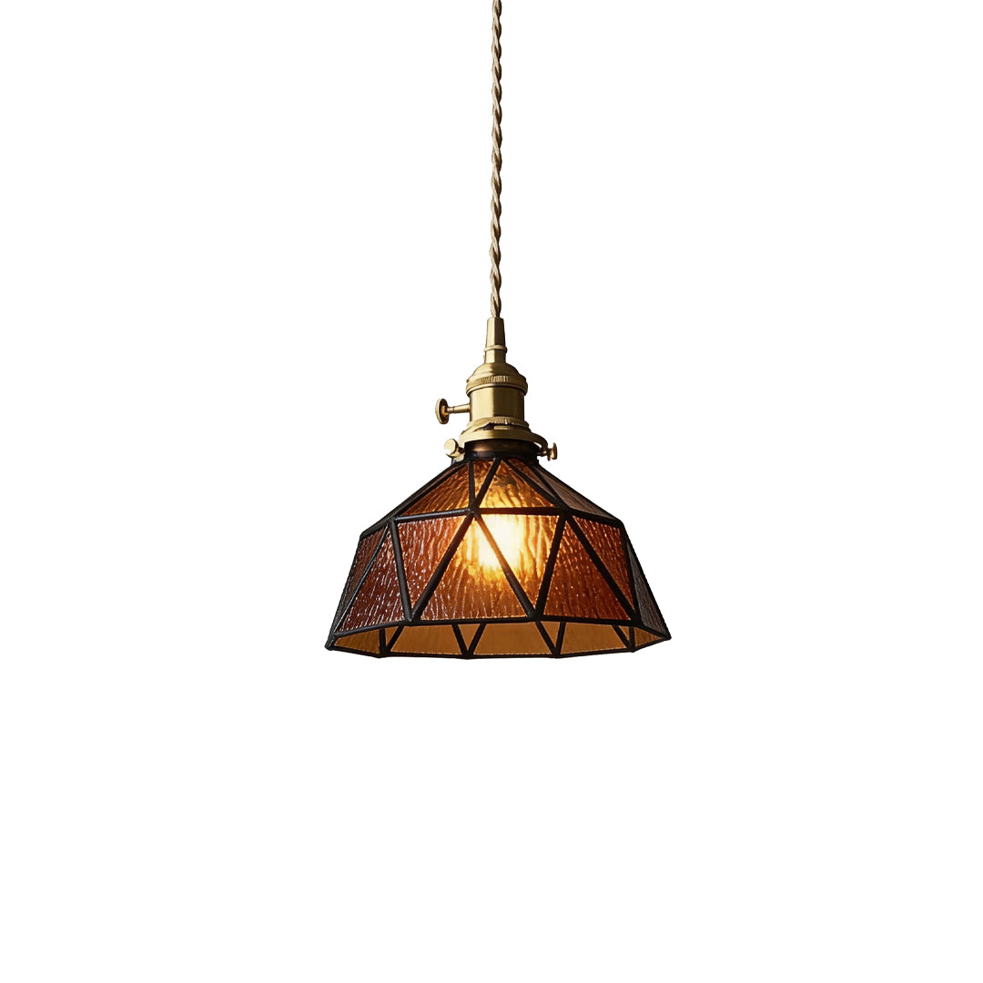 Warm glowing amber indoor pendant light with textured brown glass and industrial brass socket.