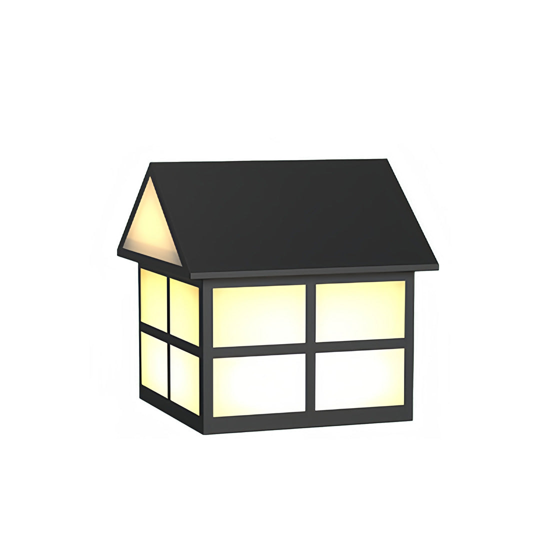 Warm illuminated gate pillar top lights featuring a structured grid frame and modern cottage-style roof.