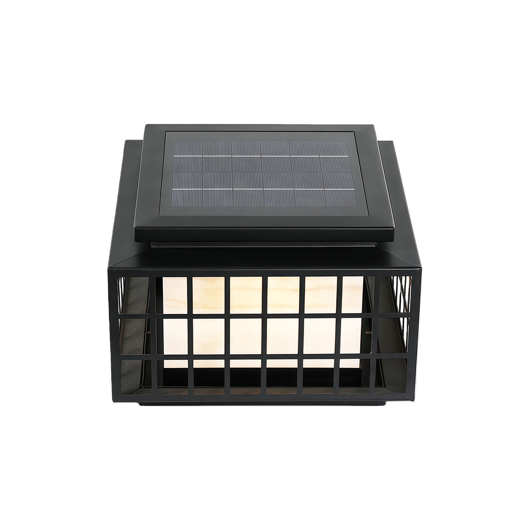 Modern gate pillar light with a black metal grid, providing warm illumination for outdoor spaces.