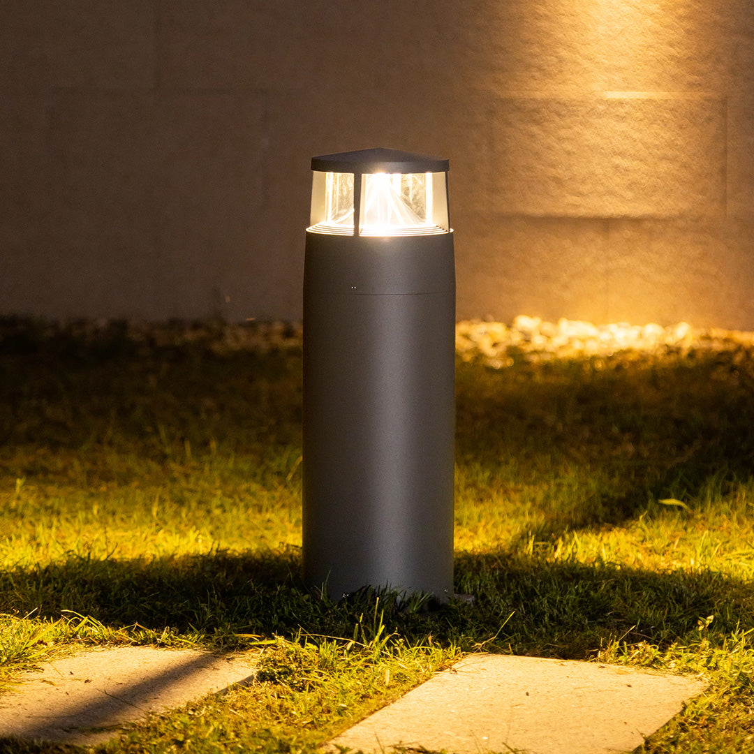 Warm LED bollard lighting creating inviting atmosphere along residential outdoor pathway
