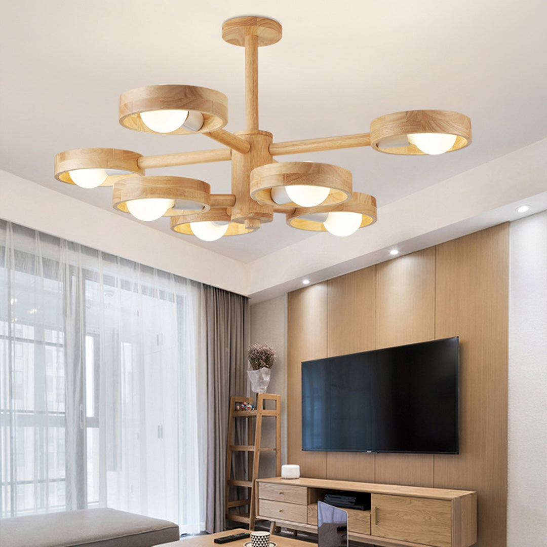 Brass glass shade chandelier providing warm illumination in modern interior wall light setting