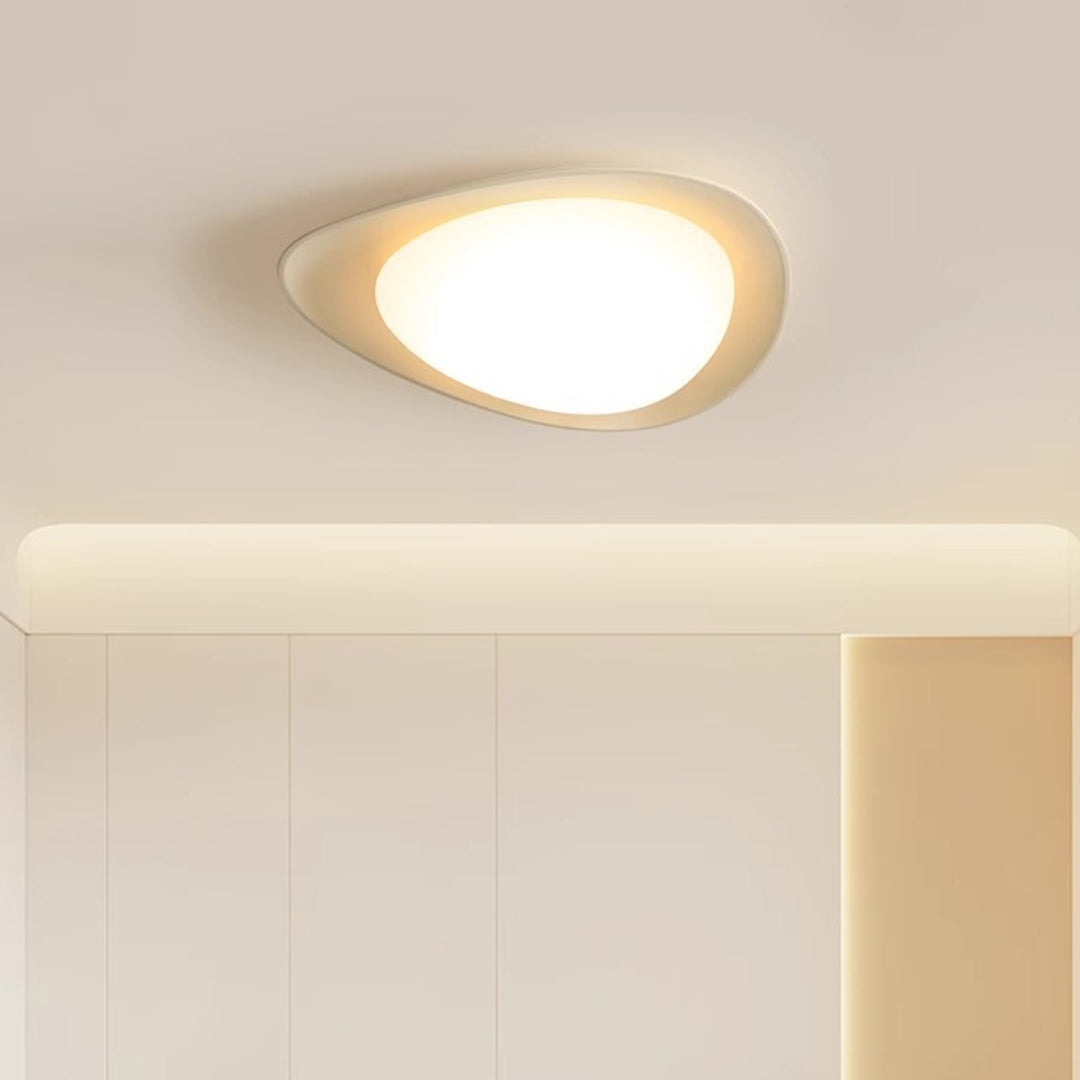 Warm-toned pebble ceiling light enhancing cozy atmosphere in modern interior setting