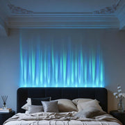 Water pattern lamp creating a calming blue wave effect behind a modern bed.