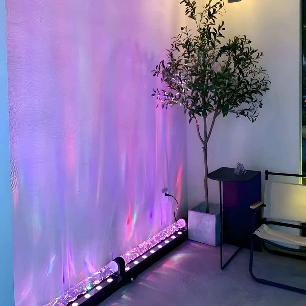 Water pattern lamp with a vibrant purple wave effect, enhancing a stylish bedroom.