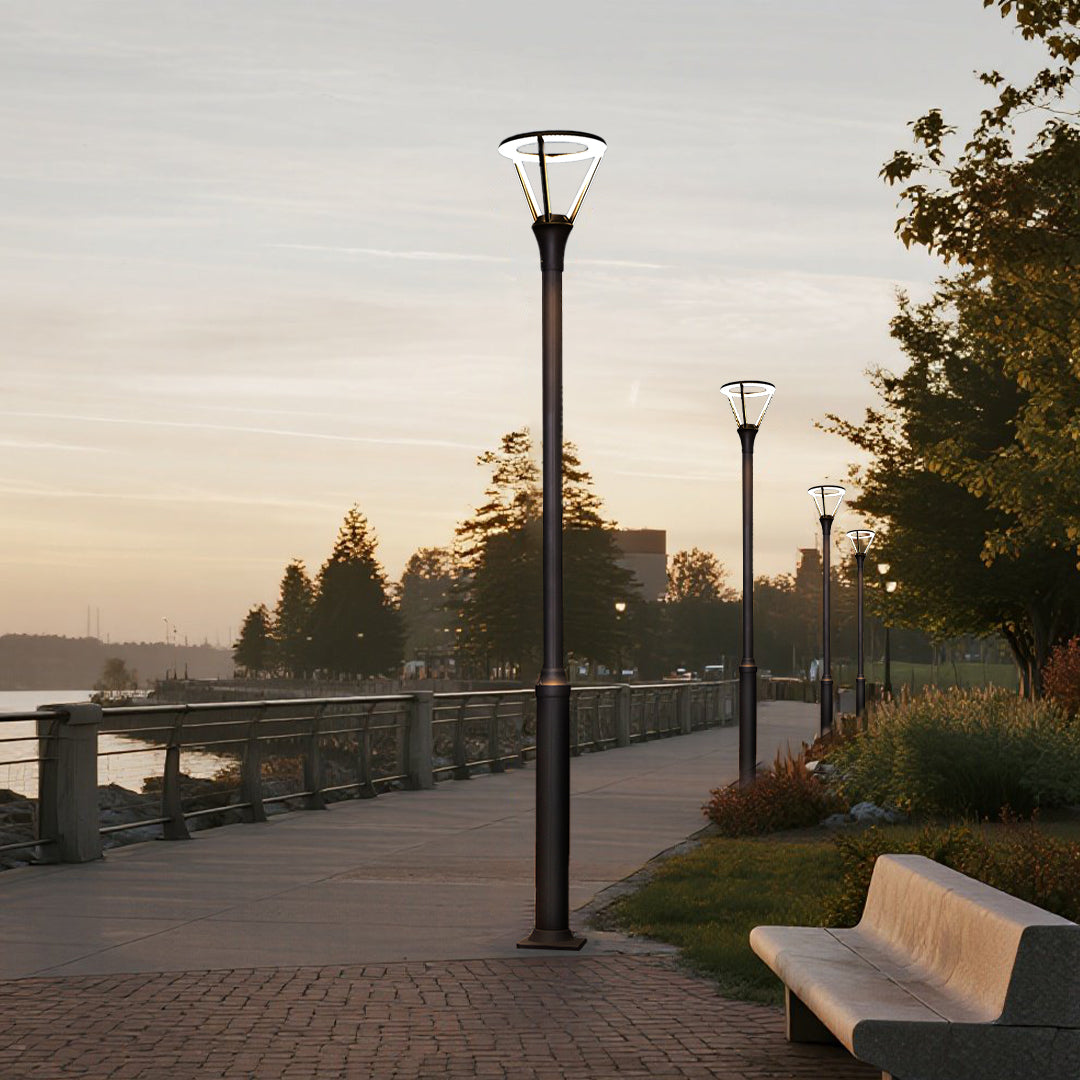 Waterfront walkway lighting with modern lamp posts creating safe pedestrian passage at dusk