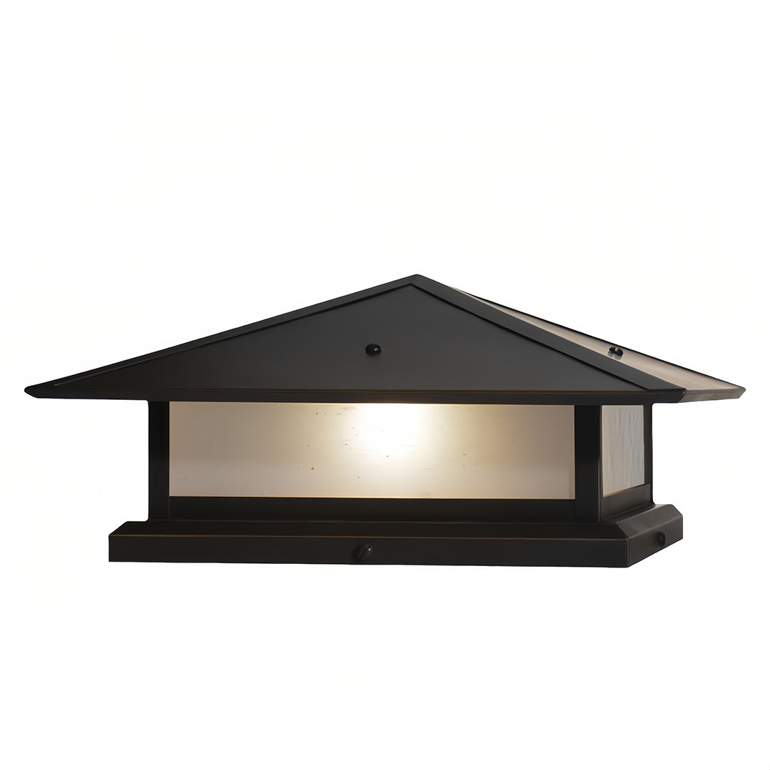 Outdoor lighting featuring a waterproof black pillar lights on a low concrete wall, creating clear boundary definition at night.