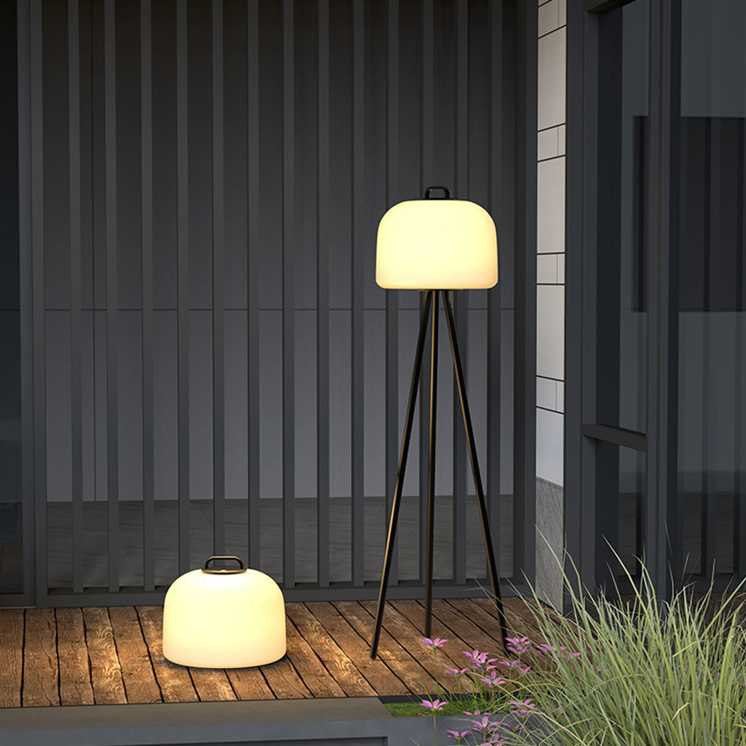 Modern exterior wall area enhanced by waterproof outdoor floor lamps positioned on the ground.