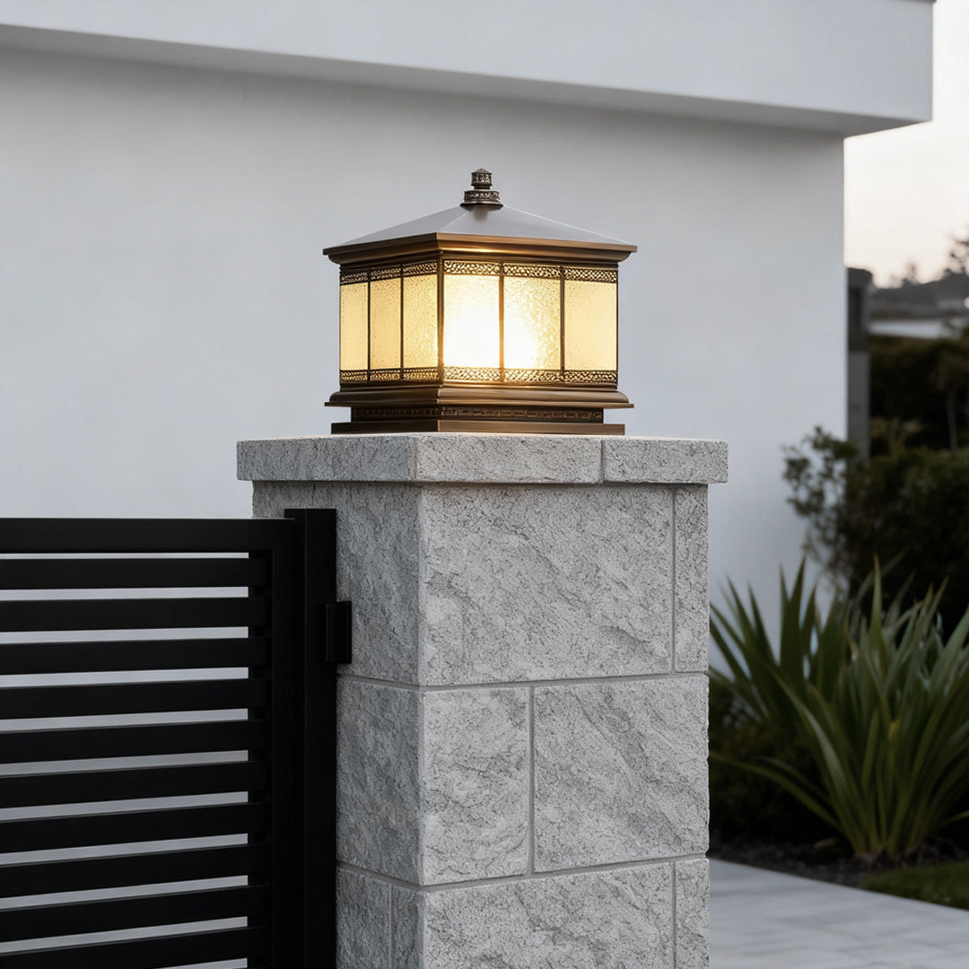 Waterproof outdoor gate pillar light installed on a stone column at a modern residential entrance.