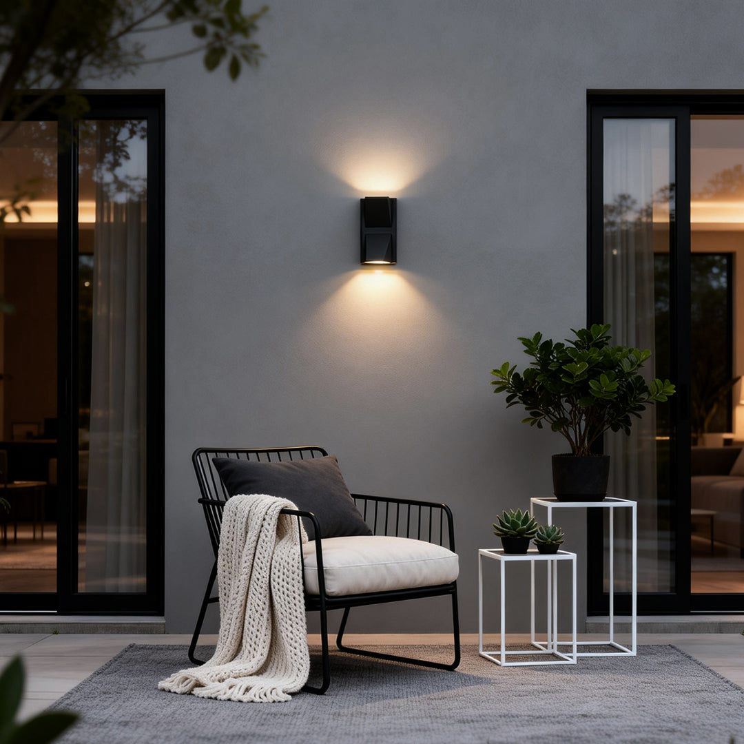 Waterproof outdoor porch lights illuminating a cozy patio seating area with warm glow.