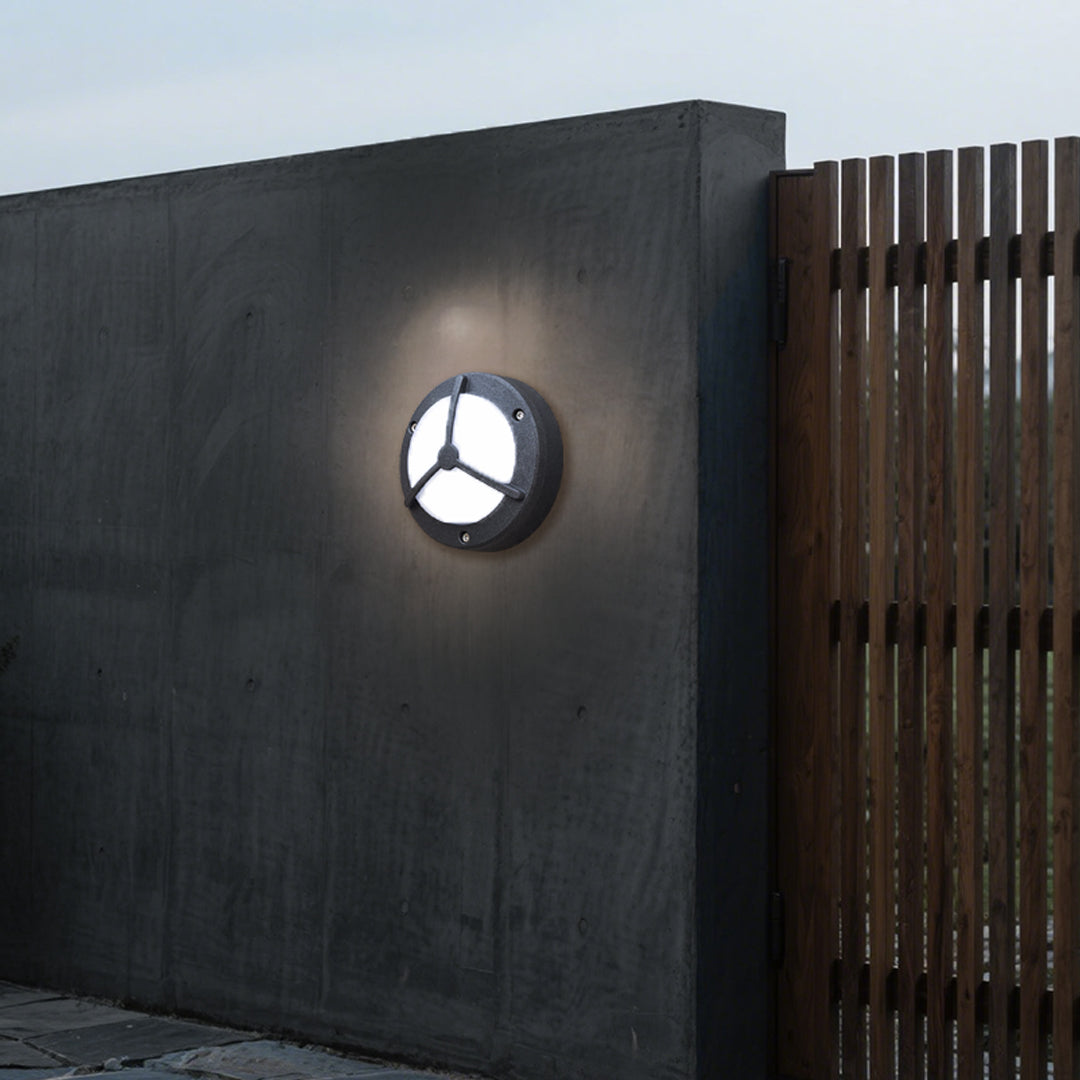 Waterproof outdoor wall lighting mounted on dark contemporary wall near wood slat detail