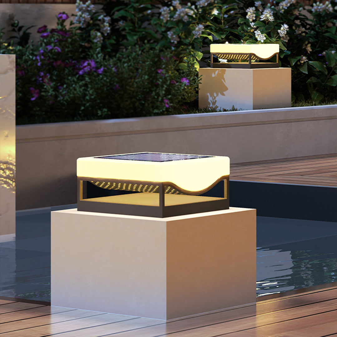 Waterside solar lighting installation creating reflective ambiance by pool edge
