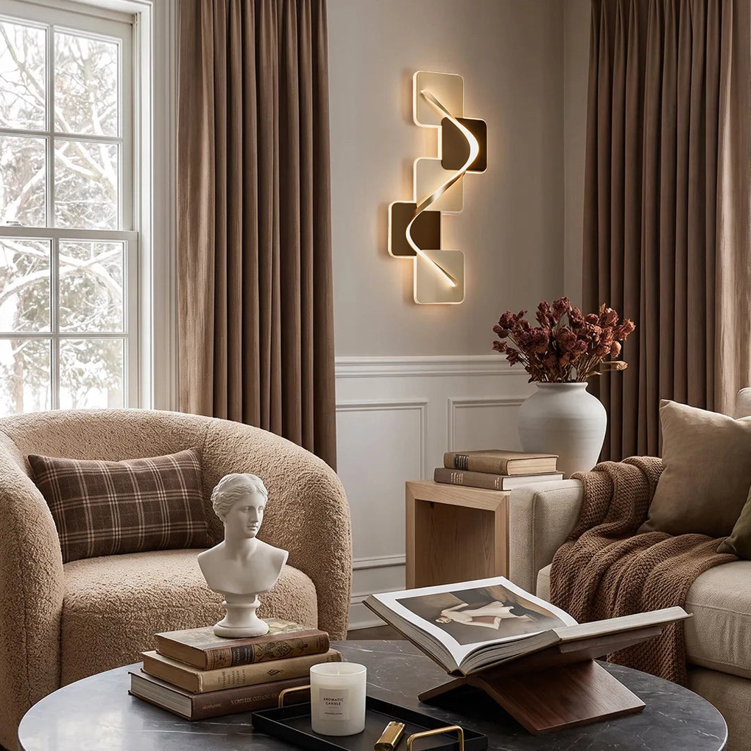 Wave pattern wall sconce illuminating a cozy lounge with textured seating and warm decor.