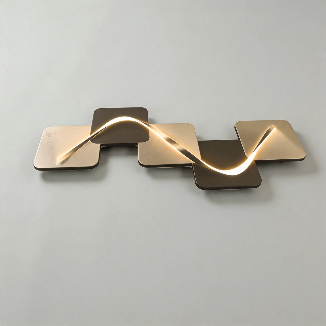 Wave pattern wall sconce in a horizontal design with layered metal panels and warm LED glow.