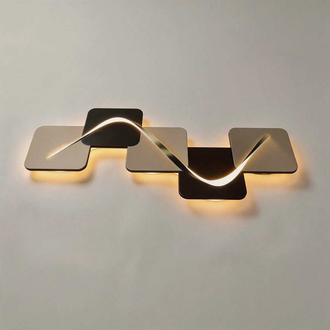 Horizontal wave pattern wall sconce with warm backlighting mounted on a white wall.