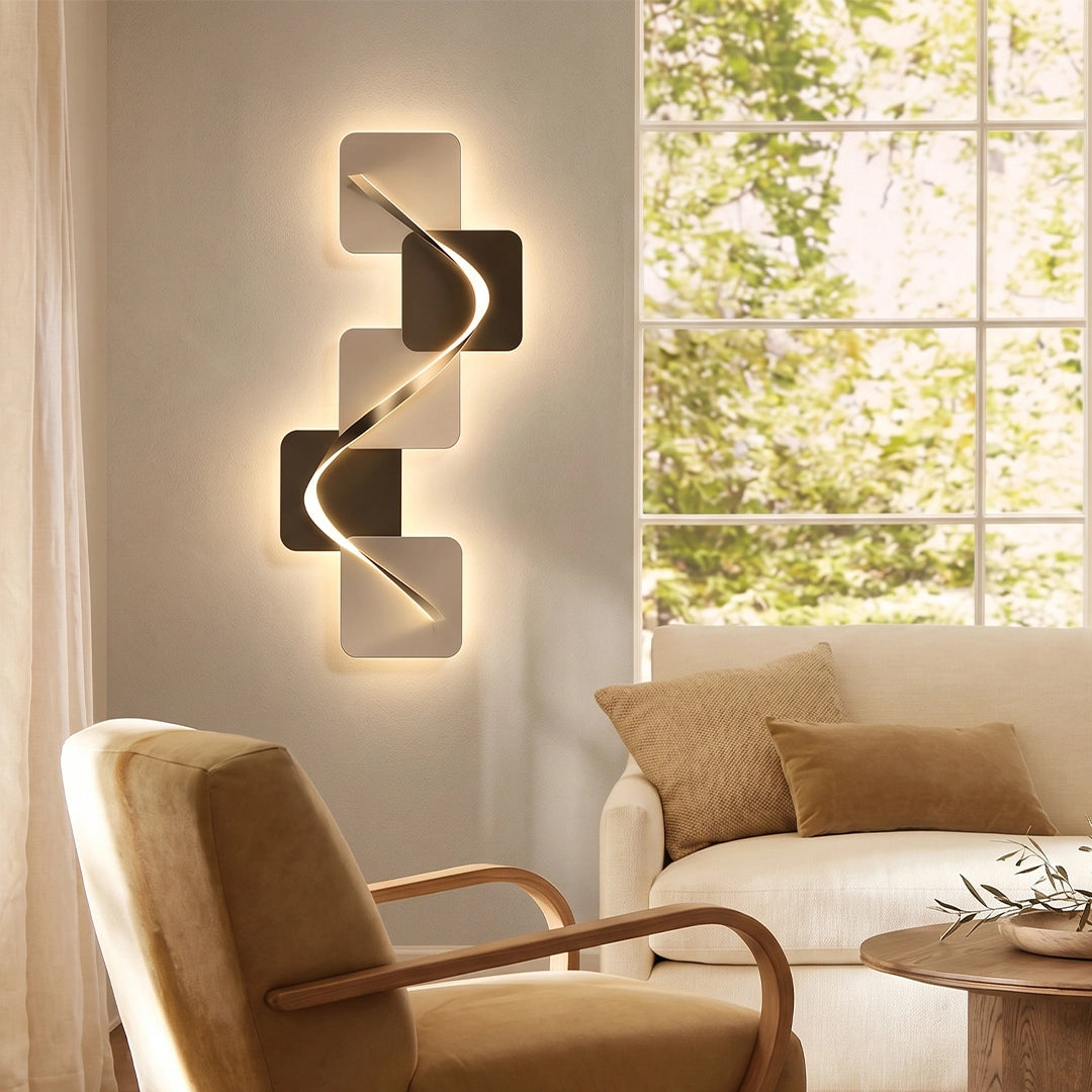 Wave pattern wall sconce on a bright wall beside a window and upholstered chair.