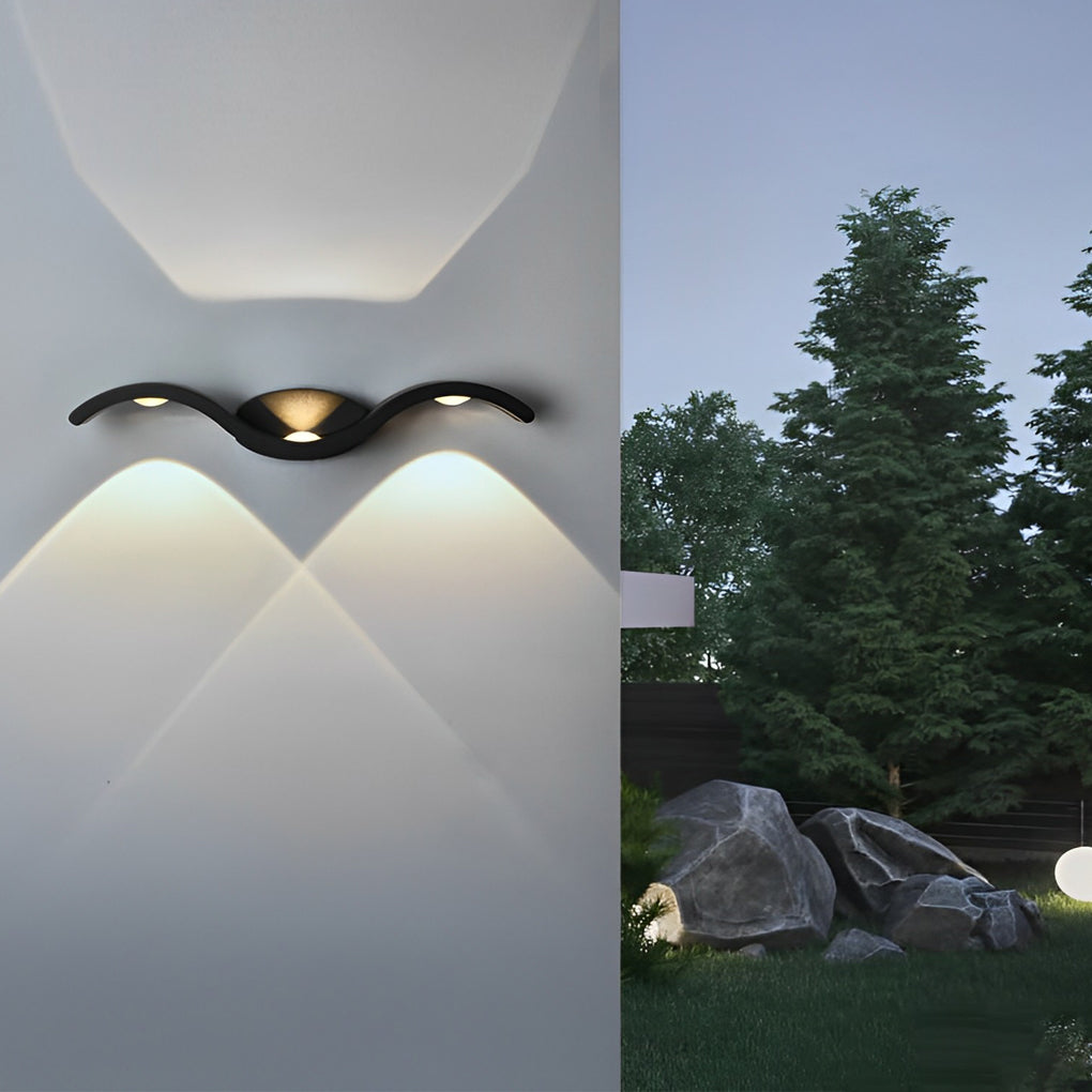 Wave wall sconce displayed in a modern interior setting above a bench, highlighting soft architectural wall lighting.