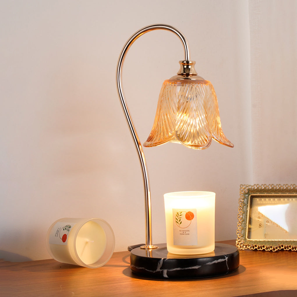 Wax melt light providing soft illumination for a stylish bedroom nightstand.
