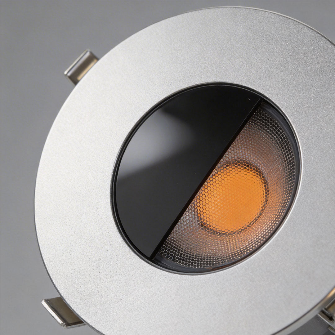 Well lights in concrete with a sleek design, mounted on a concrete surface.