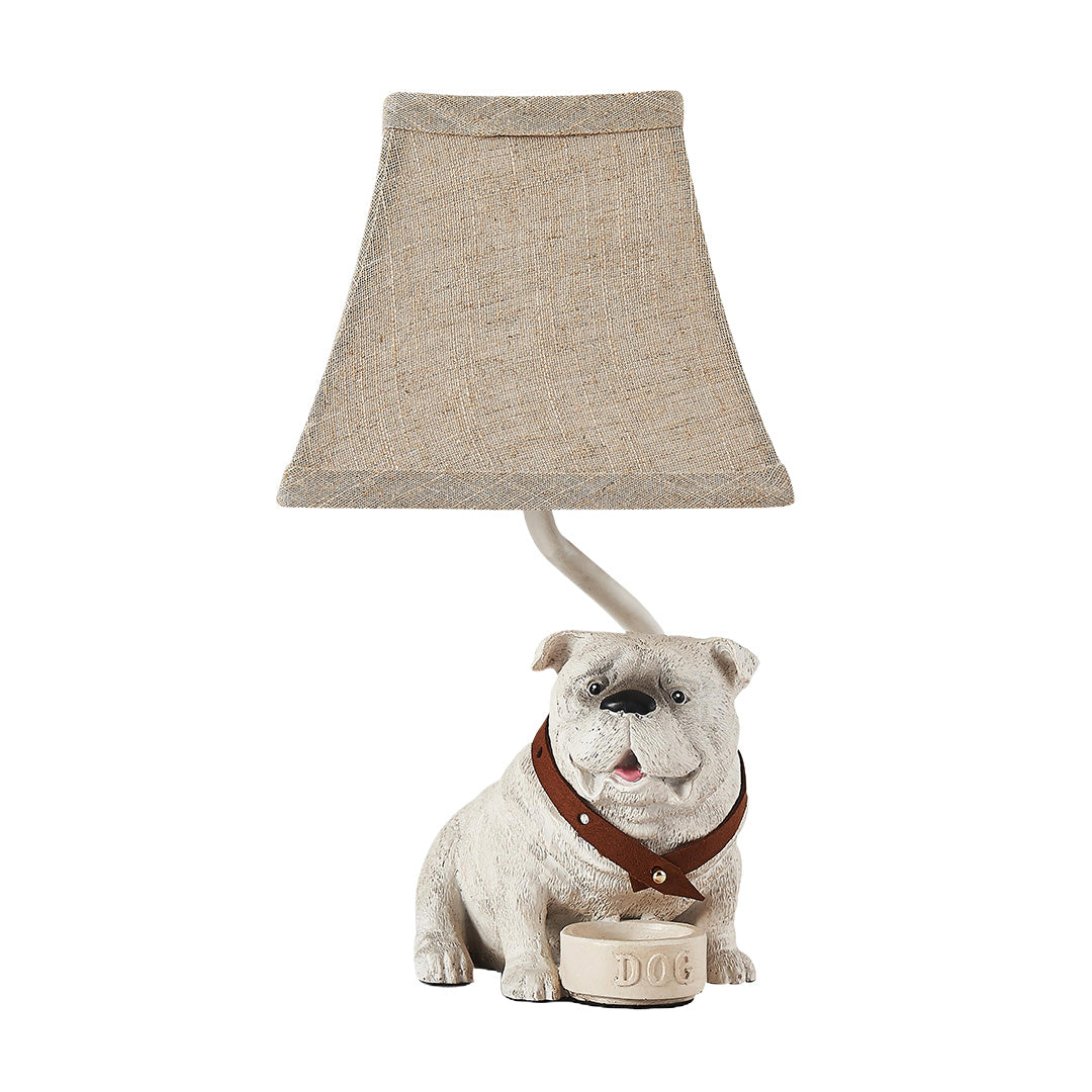 Whimsical dog table lamps featuring a highly detailed bulldog figurine base and a textured conical fabric shade.