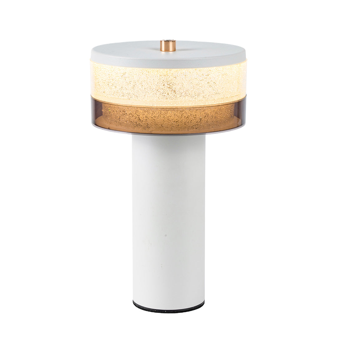 White base cylindrical table lamp with a copper accent button, showcasing its contemporary two-tone design.