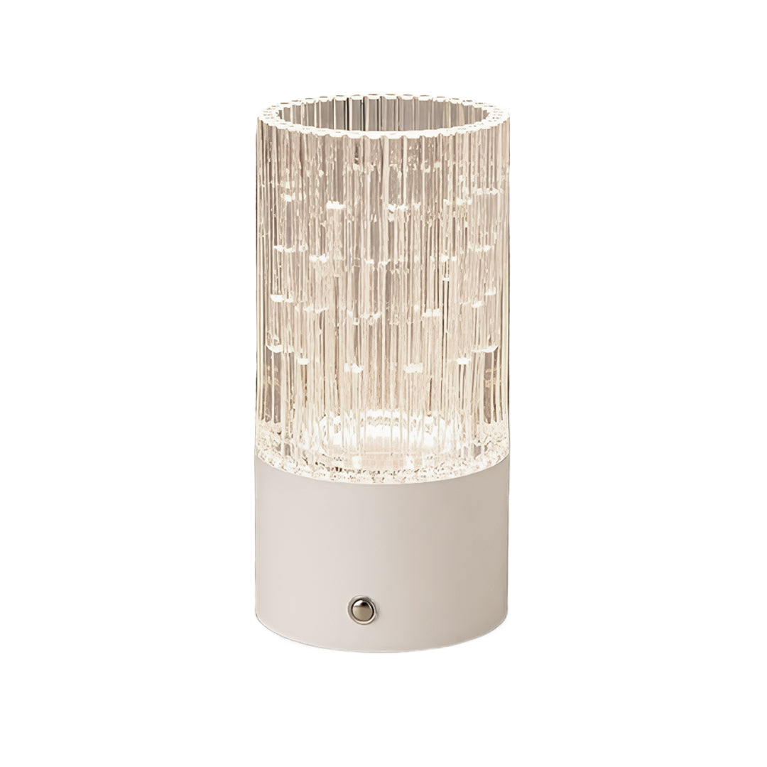 White base deco table lamp with an illuminated crystal cylinder, showcasing the elegant clear design.