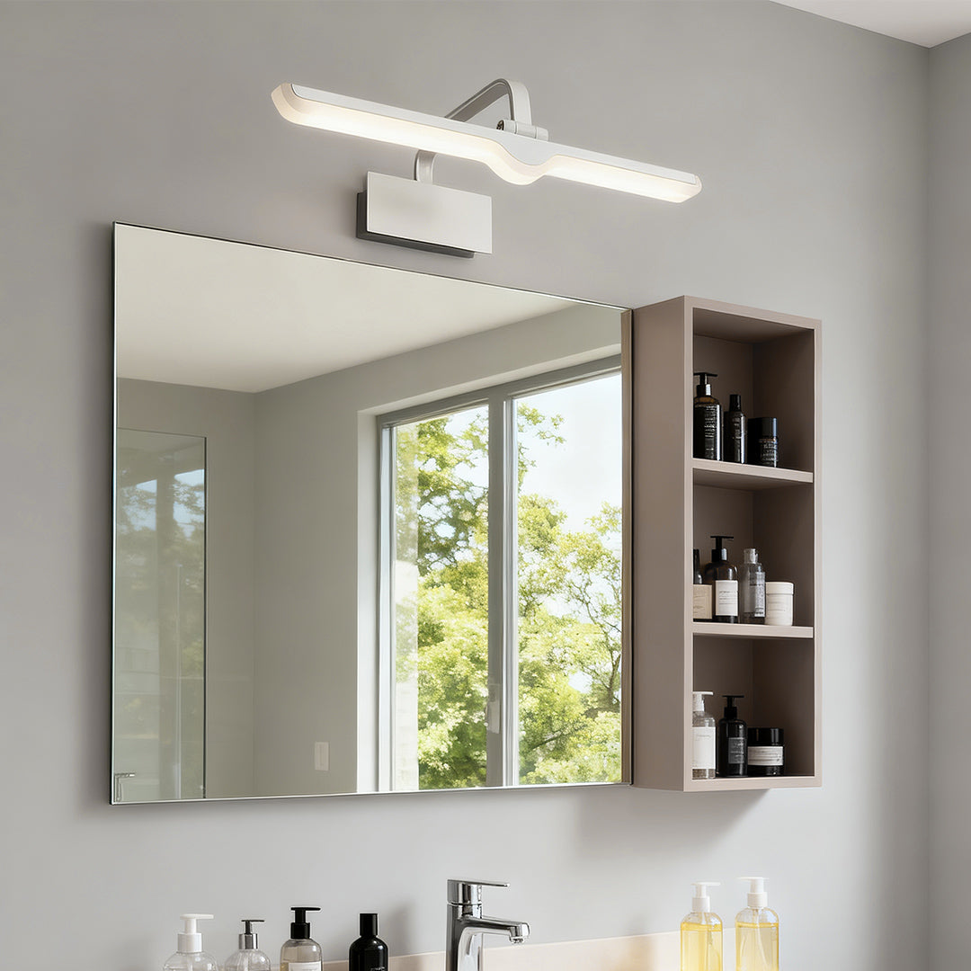 White bathroom vanity light brightening modern bathroom with wood cabinetry and marble backsplash.