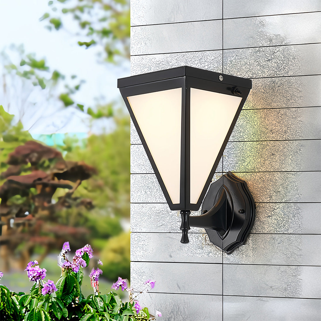 Outdoor solar lights wall mounted on white brick exterior, creating bright evening illumination.