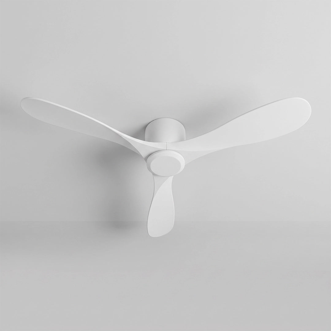 White ceiling fan with three curved blades and a compact central motor mounted on a white ceiling.