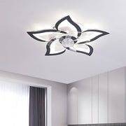 Flower-shaped LED ceiling light installed in modern white bedroom interior