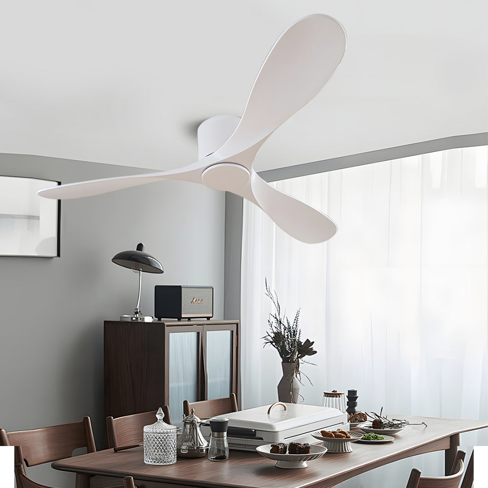 White ceiling fan enhancing a modern dining room with a wooden table and chairs.