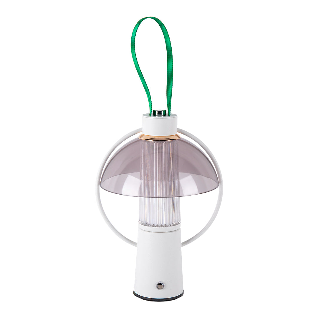 Studio shot of a white circle table lamp featuring a green handle and a translucent smoky gray top shield. 