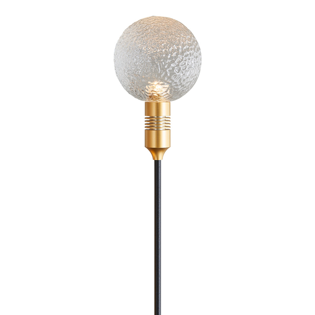 White crackle-glass garden stake light providing subtle glow for path landscape lighting.