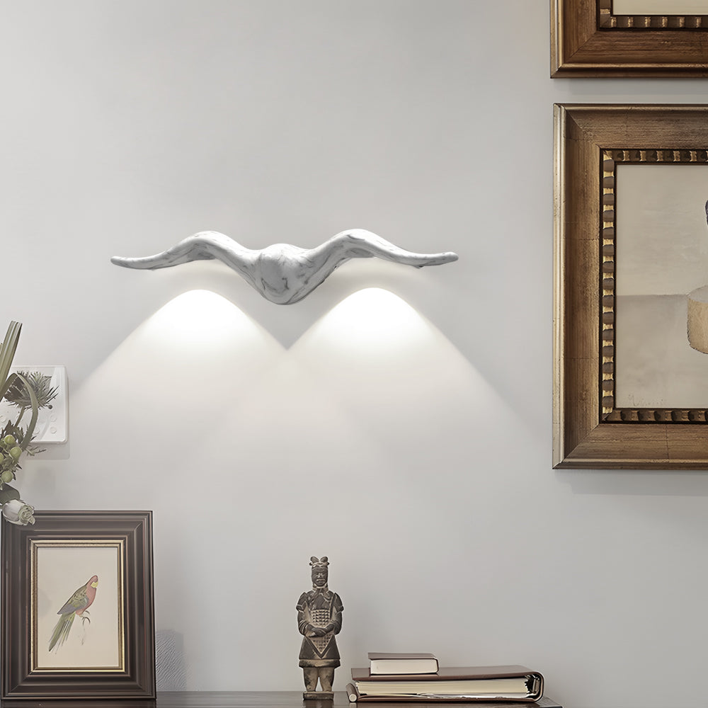 White curved two light outdoor wall sconce providing elegant illumination in modern interior setting