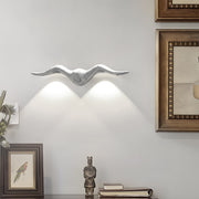 White curved two light outdoor wall sconce providing elegant illumination in modern interior setting