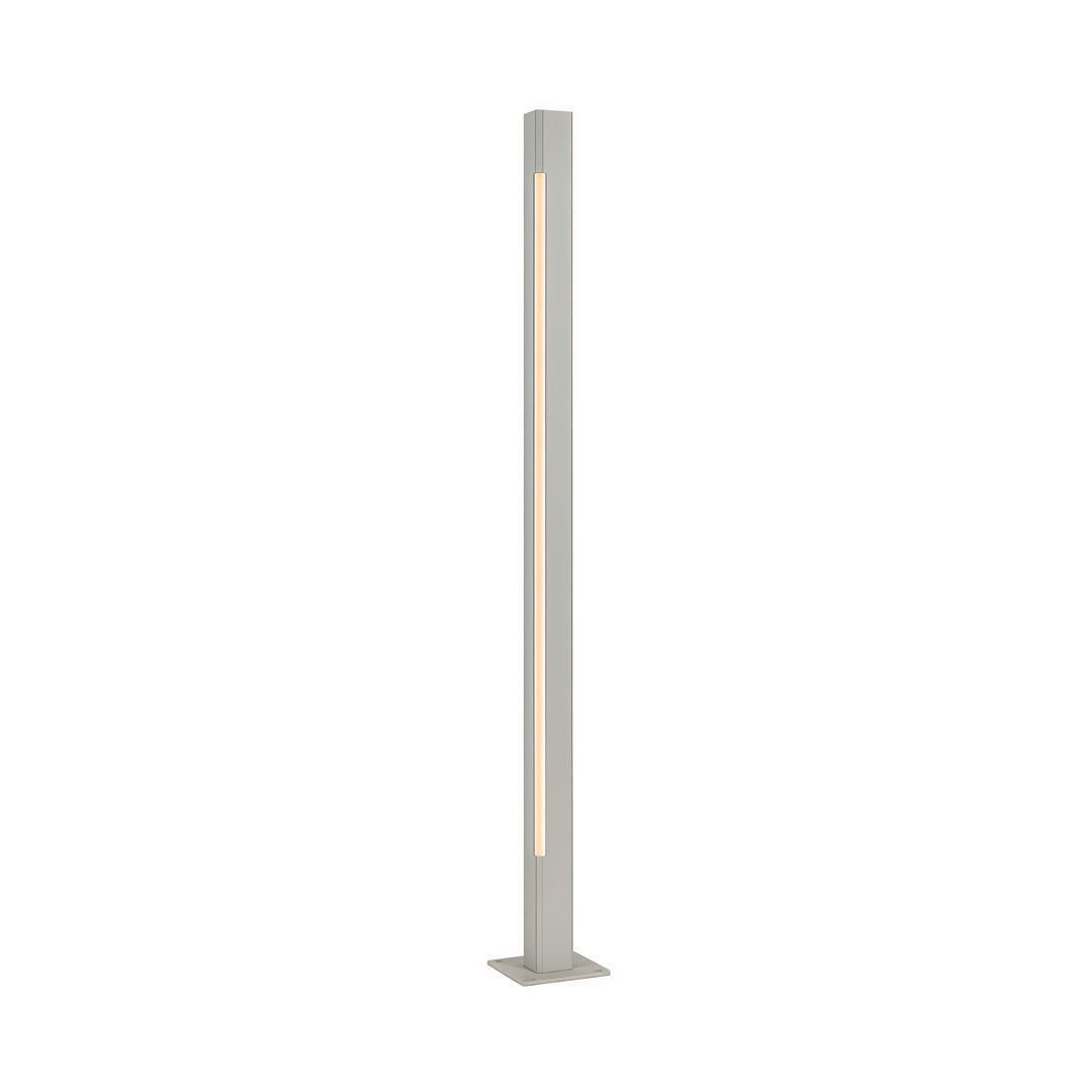 Slim white cylindrical led bollard light fixtures with a clean modern look designed for minimalist exteriors.