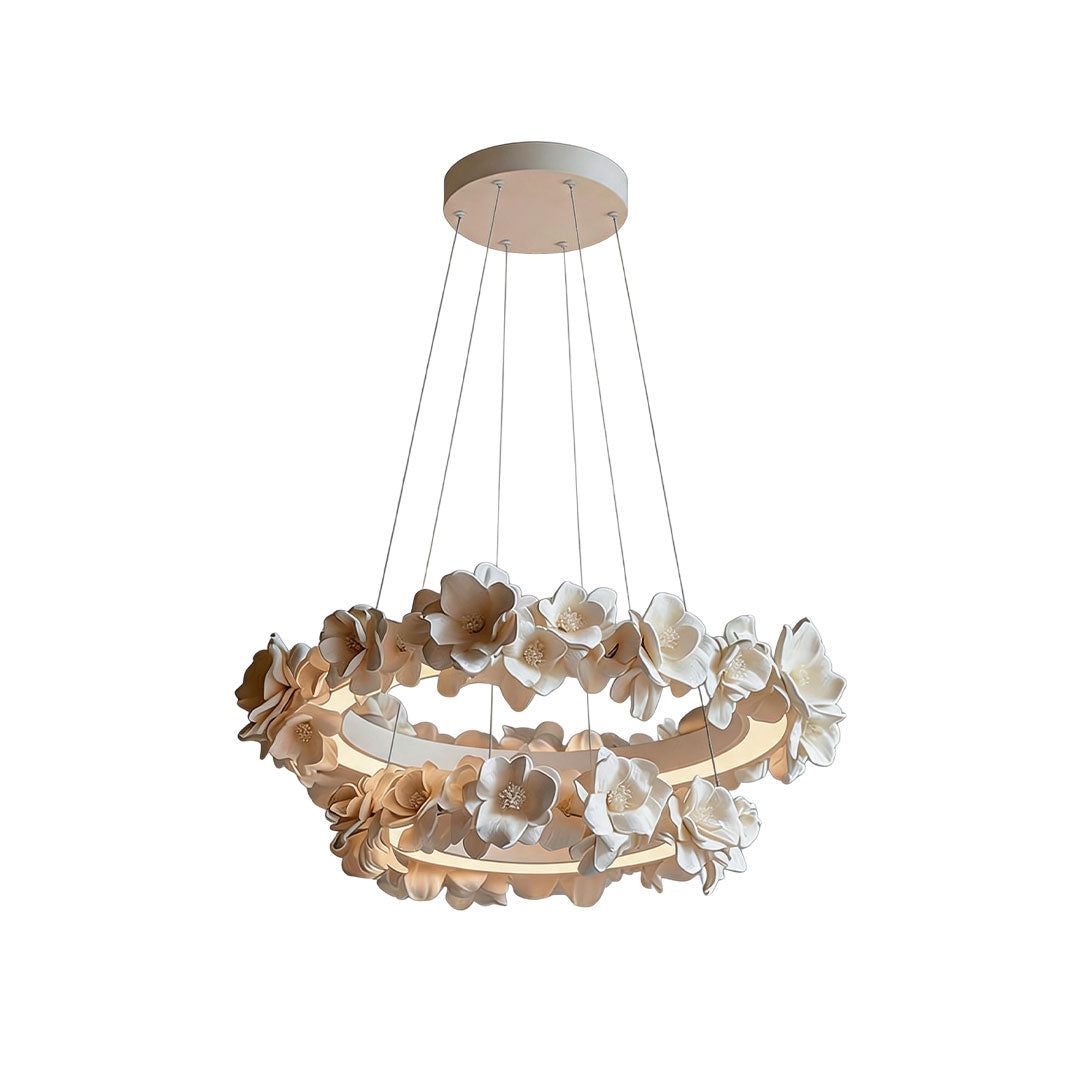 White dining room chandelier with two illuminated rings and layered floral details.