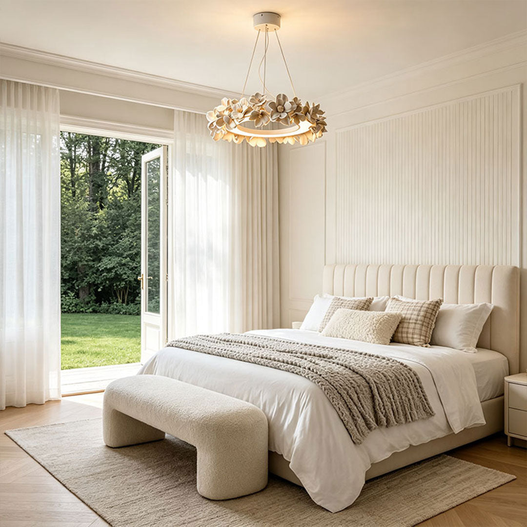 White dining room chandelier installed in a neutral bedroom with warm integrated illumination.