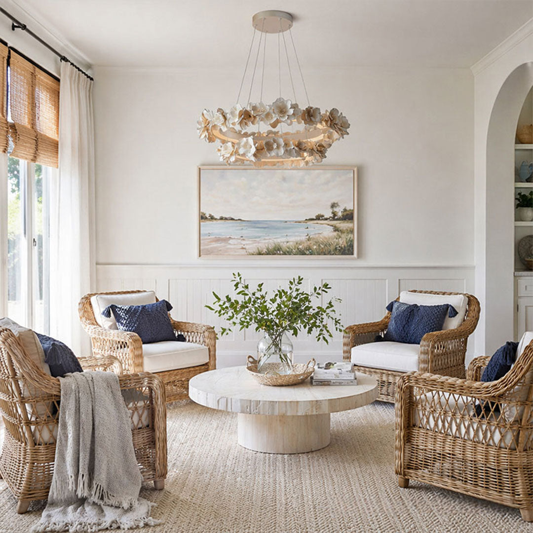 White dining room chandelier hanging above a sitting area with layered floral decorations.