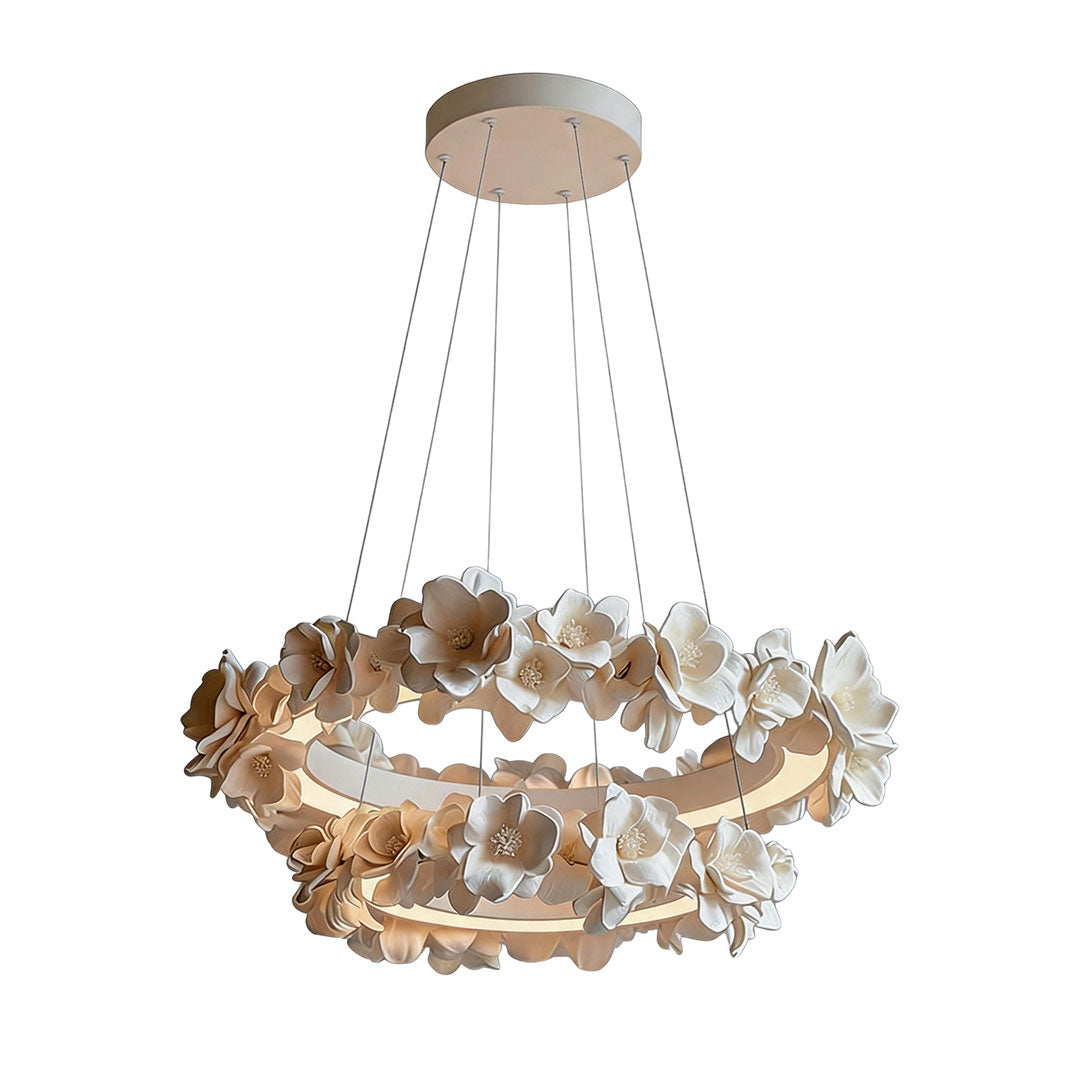 White dining room chandelier featuring a tiered circular design with cascading flower accents.
