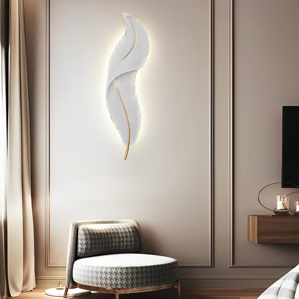 White feather wall light mounted near window seating area with elegant ambient lighting.