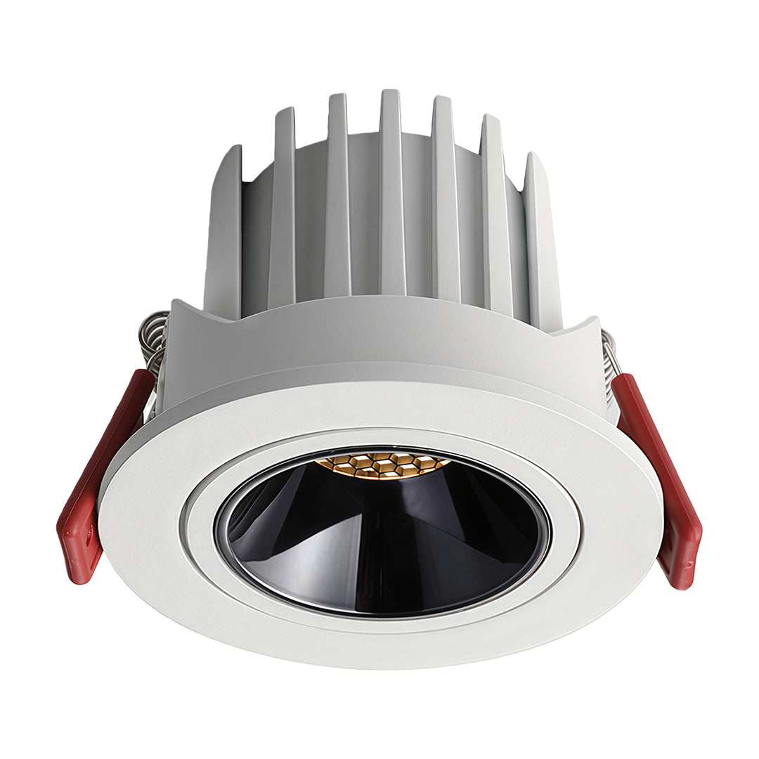 White finish directional recessed downlight fixture featuring an adjustable gimbal head and black anti-glare baffle.