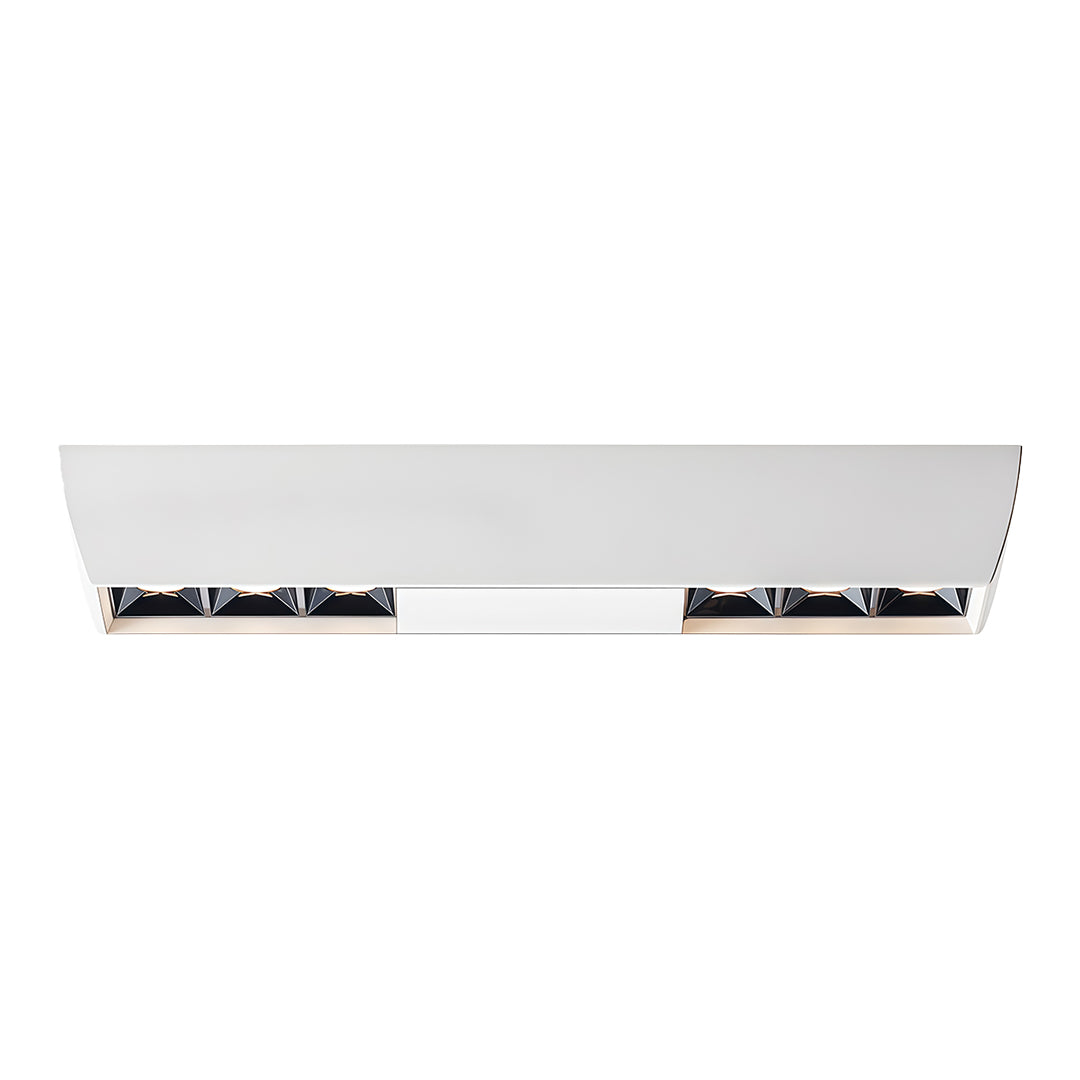 White surface-mounted fixture featuring two sets of recessed square downlights, isolated on white.