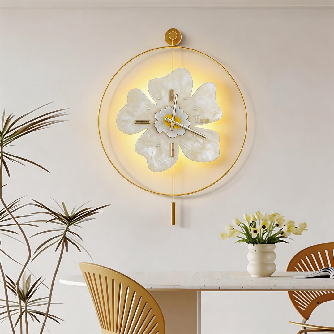 Luxurious white flower wall clock with light illuminating a modern dining room interior.