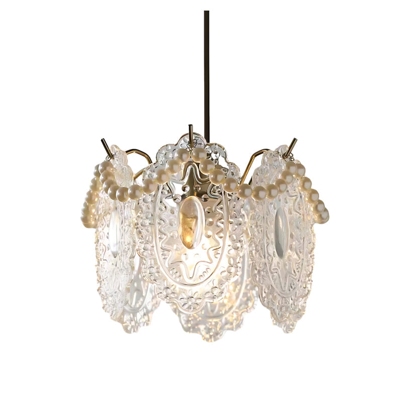White glass pendant lights with a delicate design, hanging in a modern interior setting.