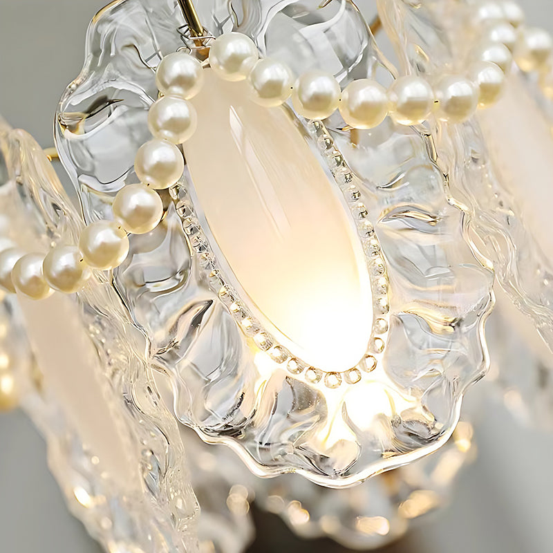 White glass pendant lights with a detailed glass pattern, providing ambient lighting.